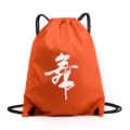 Orange drawstring dance backpack featuring white dancer silhouette, lightweight storage bag. - K Orange Dance Character