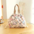 Pink rocking horse bento lunch bag with drawstring closure and sturdy canvas handles. - Pink Rocking Horse Drawstring Lunch Bag