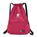 Magenta drawstring backpack with black straps and side mesh pockets for casual travel sports. - Mesh Bag Rose Red