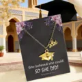 2026 graduation cap necklace on a motivational gift card featuring elegant floral design - Gold