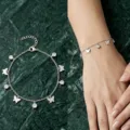 Exquisite stainless steel bracelet with butterfly and rhinestone charms on marble background - Butterfly Pendant / Silver