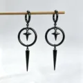 Close-up of black punk gothic spike pendant earrings with geometric star design - Round Cone Tassel Style / Black