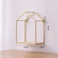 Modern house shaped golden metal wire wall shelf with a light wood base for home - 15x10x20cm