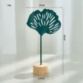 Modern Nordic teal green iron ginkgo leaf sculpture ornament with round natural wooden base - Hollow Ginkgo Leaf Ornament / Navy Blue