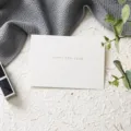 White greeting card with happy new year text, elegant holiday blessing card for celebration. - Happy New Year Single Card