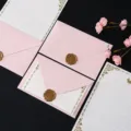 Pink envelope and stationery set with wax seal and floral decor, romantic and elegant. - 3 Pink Envelopes + 10 White Rabbit Stationery Sheets + 3 Bronze Wax Seals