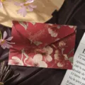 Detailed shot of retro red envelope with embossed floral patterns, luxury brocade style. - 1 Envelope / Begonia Red