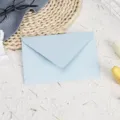 Detailed view of the elegant light blue pearlescent envelope, perfect for letters and cards. - Light Blue