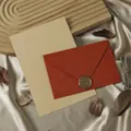 Retro stationery set featuring a textured red envelope, wax seal stamp, and lined kraft letter paper. - Vibrant Orange: 3 Envelopes + 10 Kraft Lined Letter Papers + 3 Seals (Soft Rubber) / Vibrant Orange