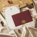 Detailed view of vintage stationery letter paper and dark red envelope with wax seal design. - 3 Cashmere Jujube Red Envelopes + 10 Sheets White Rabbit Writing Paper + 3 Wax Seals