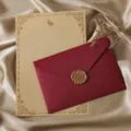 Detailed view of vintage stationery letter paper and maroon envelope with wax seal design. - 3 Wine Red Linen Envelopes + 10 Kraft Rabbit Stationery + 3 Wax Seals