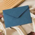 Detailed view of dark blue textured paper envelope on satin background, elegant retro stationery. - 1 Envelope / Sapphire Blue
