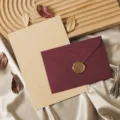 Retro vintage stationery letter paper and envelope detail view with wax seal and dry leaves decor - Envelope and Letter Paper Set / Burgundy