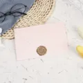 Pink envelope detail shot with wax seal on textured background, perfect for greeting cards. - Light Pink with 1 Bronze Wax Seal / Light Pink