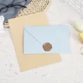Detailed shot of vintage stationery set with blue envelope, lined paper and wax seal. - 3 Light Blue Envelopes + 10 Kraft Lined Letter Papers + 3 Wax Seals / Light Blue