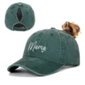 Close-up of Mama embroidery and ponytail hole design on dark green washed baseball cap - Adjustable / Grass Green