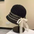 Black knit bucket hat with white stripes and elegant lace bow for women sun protection - Hollow Bucket Hat / Black
