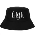 Detailed close-up of white Gigi embroidery on a black cotton bucket hat. - Adjustable / Black
