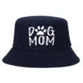 Detailed view of white DOG MOM embroidery on navy blue cotton bucket hat - Adjustable / Navy Blue