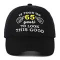 Detailed macro view of 65th birthday gift black cotton embroidered baseball cap. - Adjustable / 65th Birthday Style