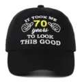 Detailed macro view of embroidery on a black 70th birthday gift cotton baseball cap. - Adjustable / 70th Birthday Style