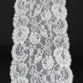 Detail view of white elastic lace fabric trim, 17cm width, hollow floral DIY sewing. - White