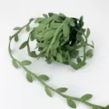 Green leaf ribbon detail shot, fabric vine trim for DIY crafts and gift packaging decoration. - Green