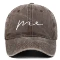 Close-up of vintage washed brown baseball cap with white 'me' embroidery detail - Adjustable / Coffee