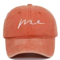 Front view of an orange washed cotton baseball cap with white 'me' embroidery. - Adjustable / Orange