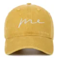 Detailed view of a yellow washed cotton baseball cap with white 'me' embroidery - Adjustable / Yellow
