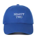 Classic blue cotton baseball cap featuring white NINETY TWO embroidered text design - Adjustable / Sapphire Blue