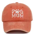 Washed orange cotton baseball cap featuring white DOG MOM embroidery and paw print - Adjustable / Orange