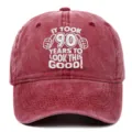 Close-up of vintage washed red cotton baseball cap with 90th birthday embroidery design - Adjustable / Burgundy