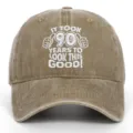 Close-up of white embroidered 90th birthday slogan on brown washed cotton baseball cap - Adjustable / Khaki