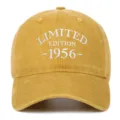 Detailed view of white 'Limited Edition 1956' embroidery on a washed yellow cotton cap - Yellow
