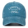 Close-up view of distressed blue washed cotton baseball cap with white 1956 embroidery - Lake Blue