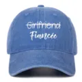 Close-up detail of blue washed denim baseball cap featuring white 'Fiancée' embroidery - Adjustable / Light Blue (Fiancee)