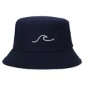 Detail view of a navy blue bucket hat featuring a white wave embroidery pattern - Adjustable / Navy Blue