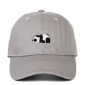 Close-up detail of the cute panda embroidery on a grey cotton soft top baseball cap - Adjustable / Gray