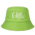 Detailed view of white Gigi cursive embroidery on vibrant lime green cotton bucket hat - Adjustable / Grass Green