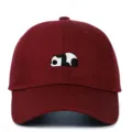 Detail showing a cute panda embroidery on a burgundy soft-top baseball cap. - Adjustable / Burgundy
