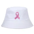 Close-up of white bucket hat with pink ribbon breast cancer awareness embroidery - White