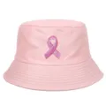 Detail view of pink bucket hat with embroidered breast cancer awareness ribbon logo - Pink