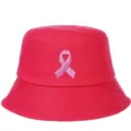Detailed view of a bright pink bucket hat featuring a pink ribbon embroidery for breast cancer awareness - Rose Red