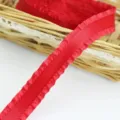 Red pleated ribbon close-up, perfect detail view of ruffled satin fabric for gift wrapping. - Red