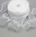 Detail view of white organza ribbon with wired edge, perfect for floral wrapping and gifts. - 6cm 4.5M/Roll / White