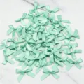 Mint green satin ribbon bows for DIY craft, sewing decoration, and gift wrapping accessories. - 50 Sheets per Pack / Mint Green