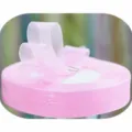 Light pink organza ribbon roll with bow, ideal for gift wrapping, floral bouquets, and baking. - 1.5cm Wide / Light Pink
