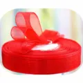 Red organza ribbon roll for gift wrapping, floral packaging, and wedding cake decoration. - Red