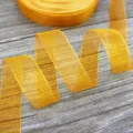 Golden organza ribbon variant for exquisite gift wrapping and flower bouquet packaging. - Turmeric